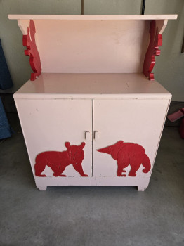 Vintage pink squirrel and bear cabinet